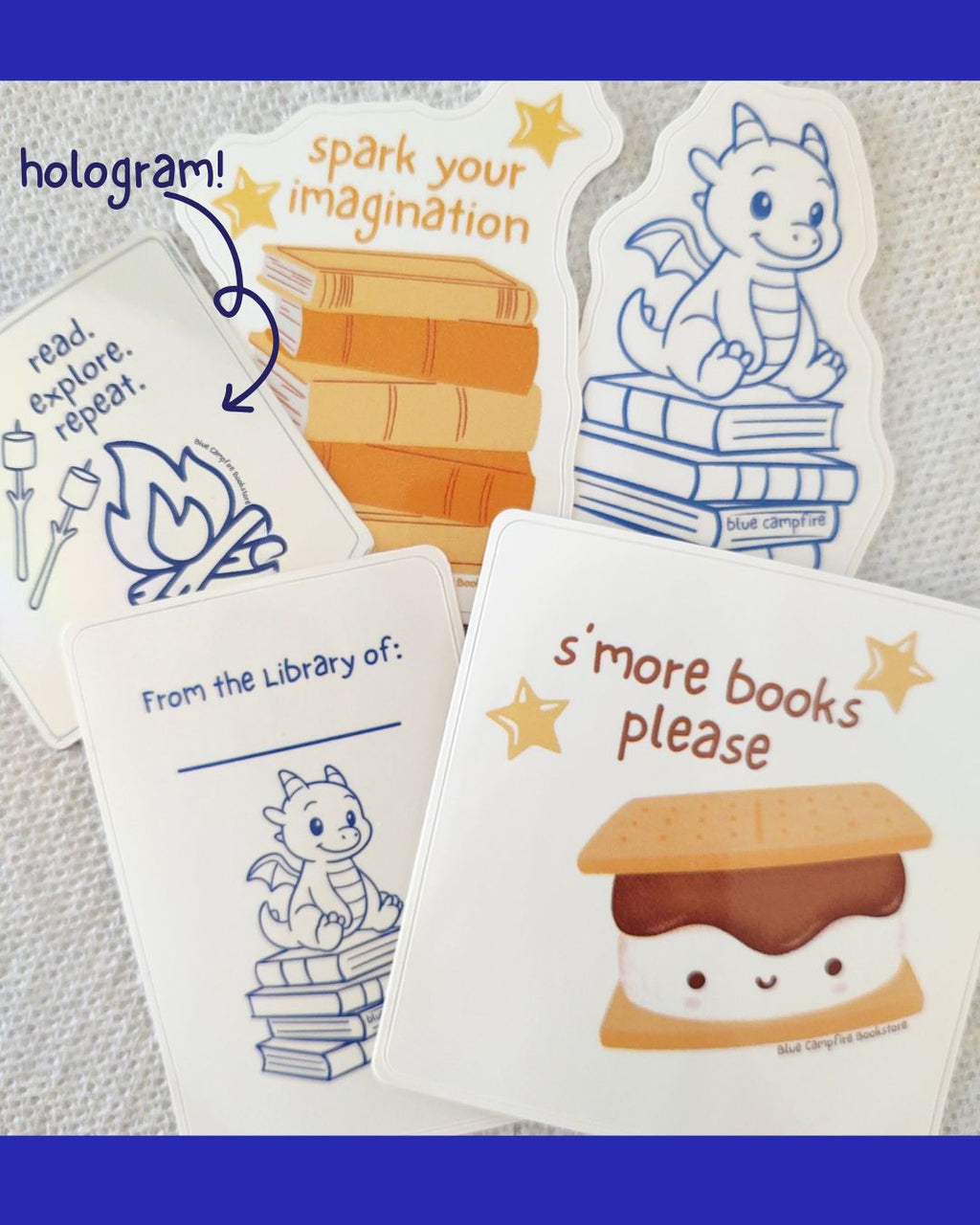 Collage of various Blue Campfire Bookstore stickers with one being noted as a hologram sticker with squiggly arrow