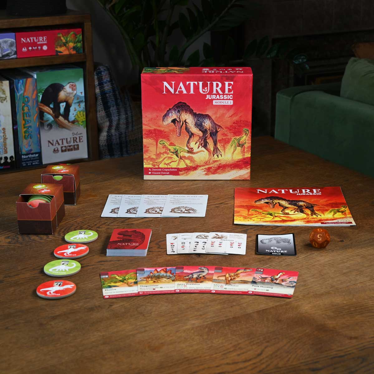Nature Jurassic board game set on a wooden table with books in the background