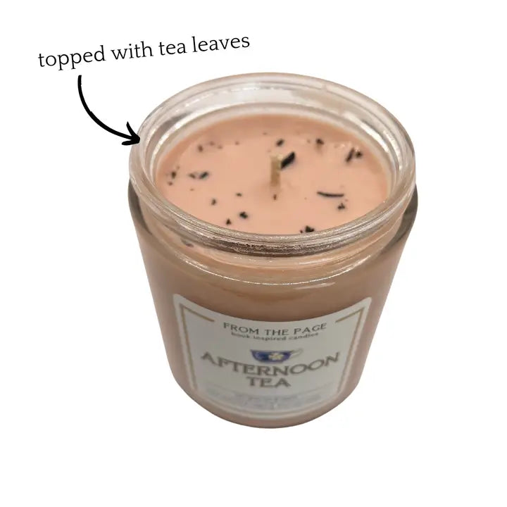 Jar candle labeled 'Afternoon Tea' with tea leaves on a white background
