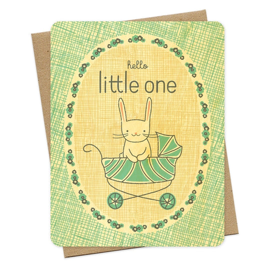 Artisan greeting card for a new baby showing a white bunny in a blue baby stroller