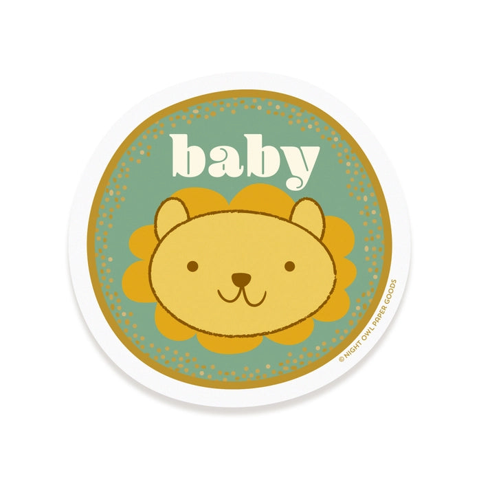 Round sticker with a lion illustration and 'baby' text on a white background
