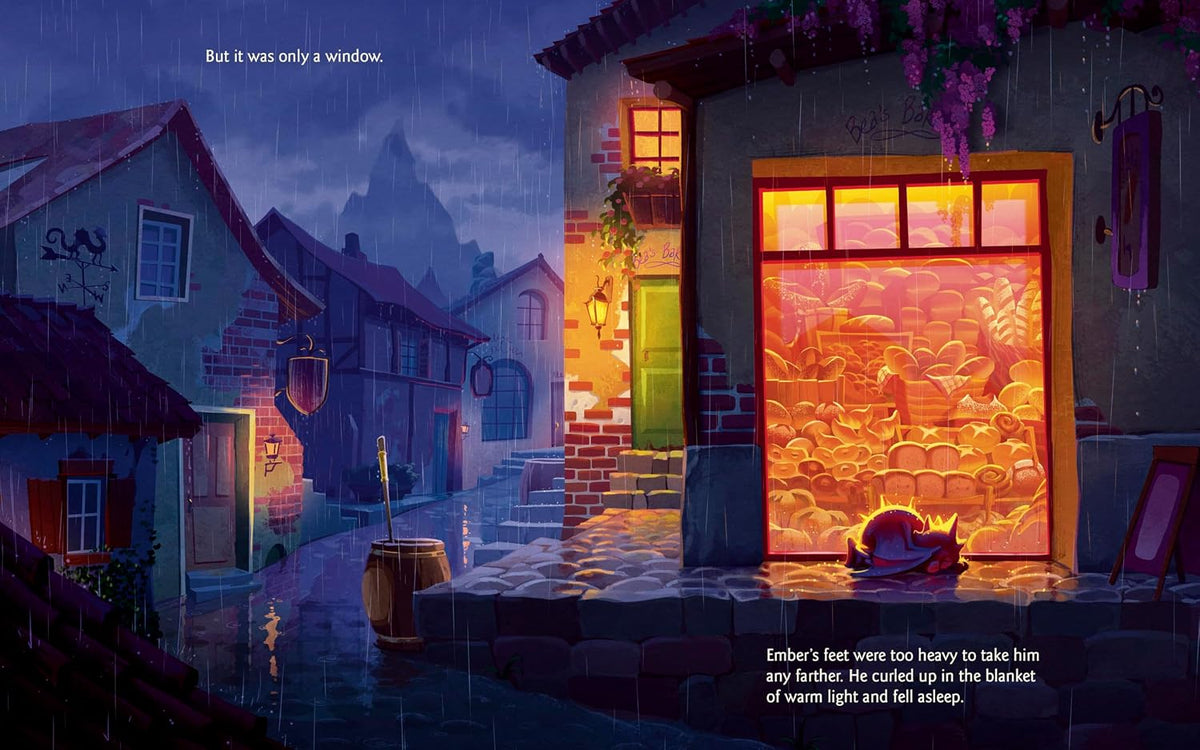 A dark, atmospheric illustrated village street at night with rain, glowing warm window lights, and a large illuminated storefront window showing a warm orange interior. Text appears at the top and bottom, suggesting this is a book or printed art page rather than a standalone product photo.