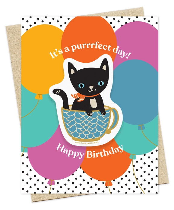 Birthday card with a black cat in a teacup and colorful balloons, text 'It's a purrfect day! Happy Birthday!' on a polka dot background.