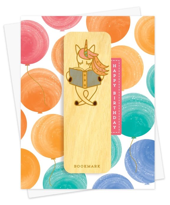 Wooden bookmark with unicorn design on a colorful card with balloons