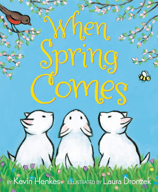 Book cover of 'When Spring Comes' with cartoon dogs and spring elements.