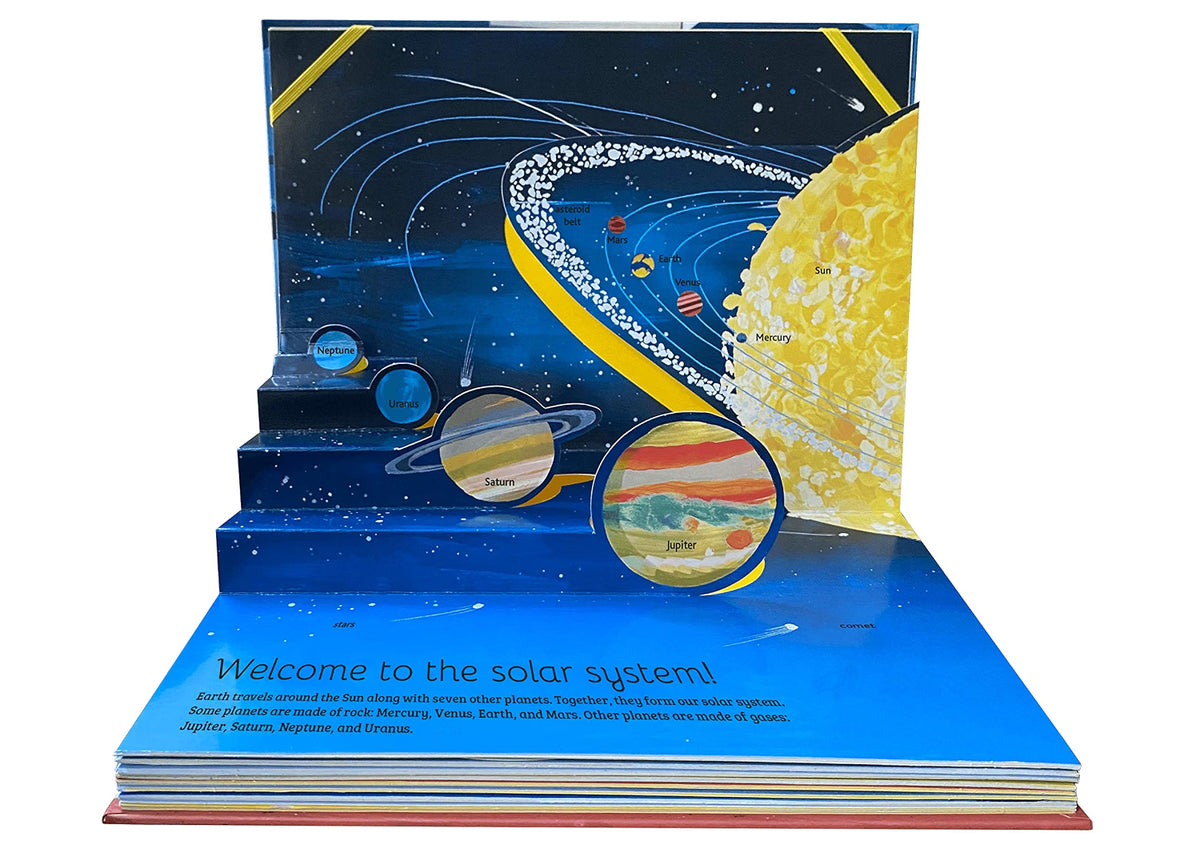Pop-up book about the solar system with planets and space-themed design.