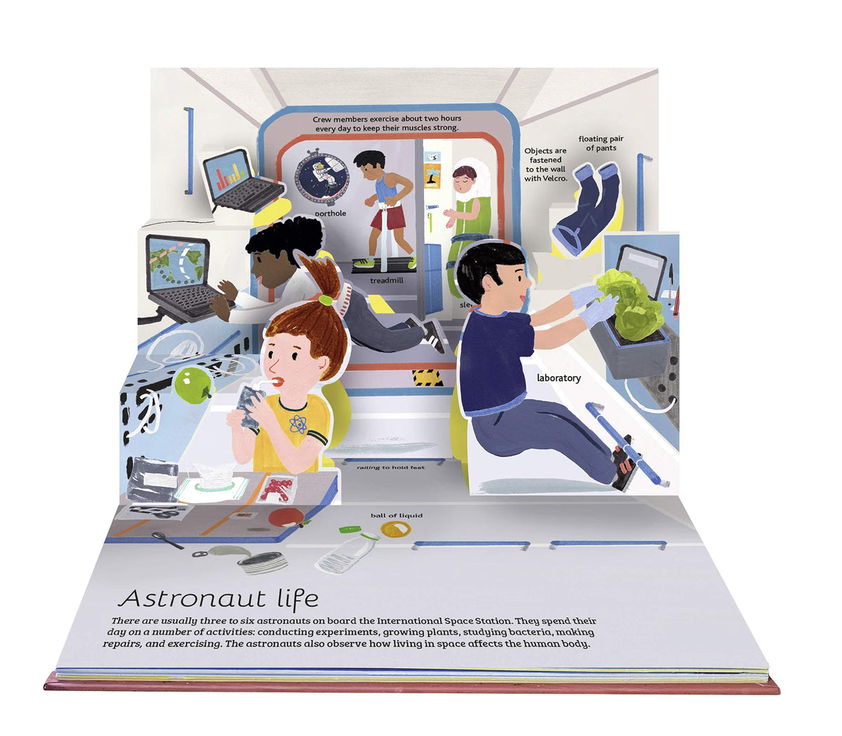 A 3D pop-up children's book titled 'Astronaut life' showing an illustrated space station interior with cartoon astronauts performing experiments and tasks.
